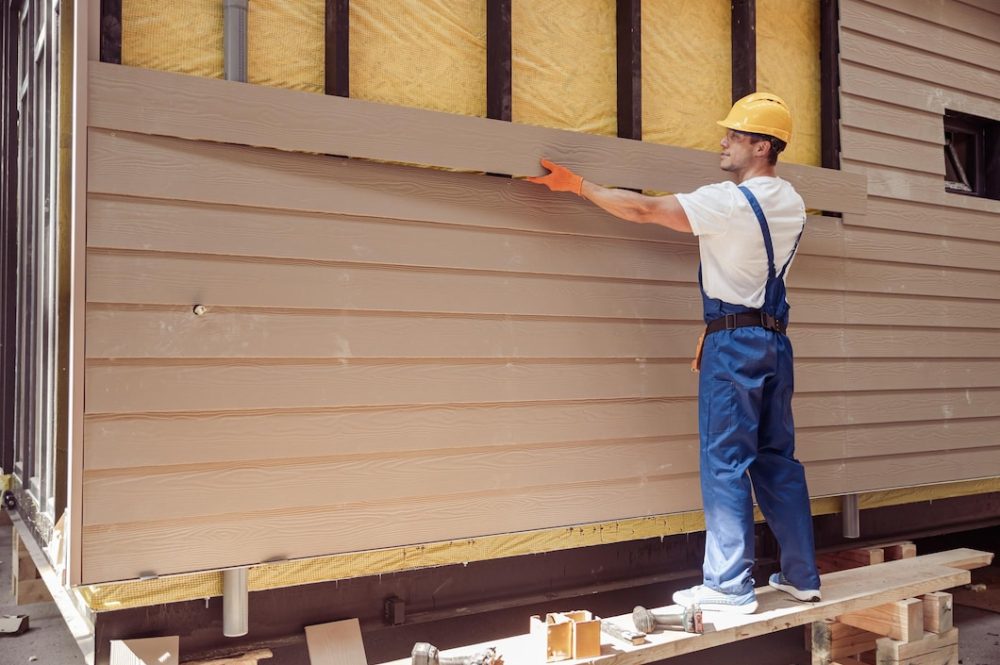 handsome-man-builder-building-cabin-construction-site_386167-17935 (1)